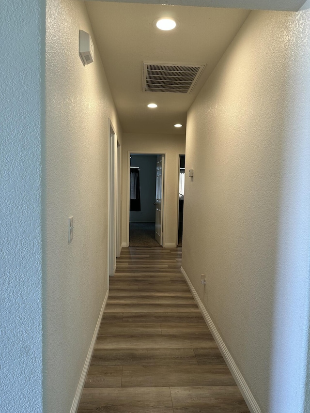 45559 Robinson Dr, Lancaster, CA 93535 - hallway with recessed lighting, dark wood-style floors, and a textured wall