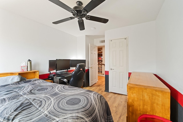 bedroom with ceiling fan and light hardwood / wood-style flooring