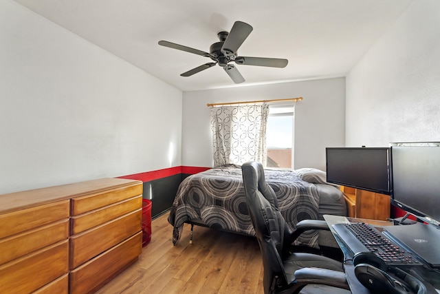 bedroom with hardwood / wood-style floors and ceiling fan