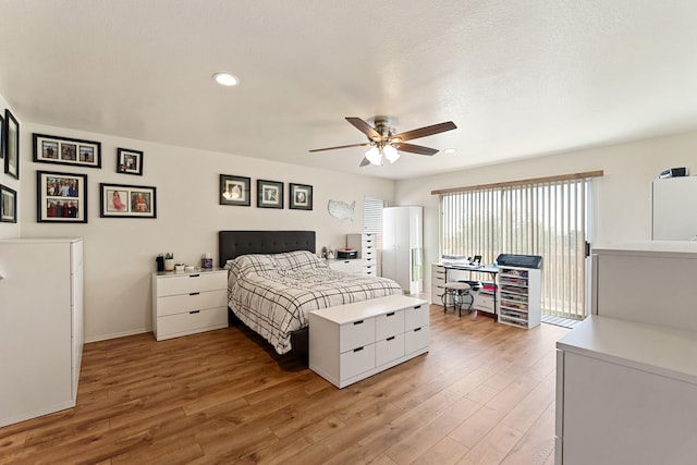 bedroom featuring hardwood / wood-style floors and ceiling fan