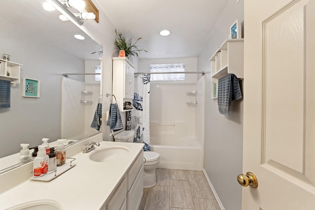 full bathroom with vanity, toilet, and shower / tub combo