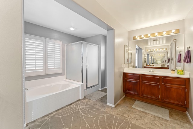 bathroom featuring separate shower and tub and vanity