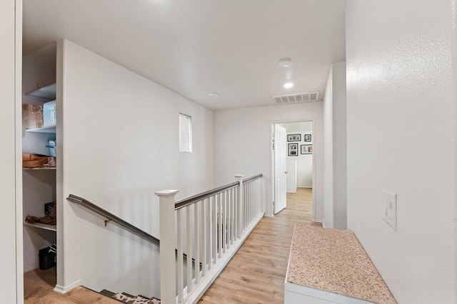 corridor with light wood-type flooring