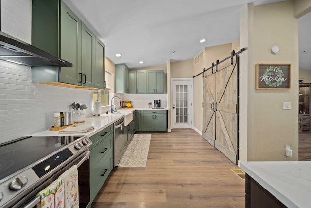 32722 Wagon Wheel Rd, Agua Dulce, CA 91390 - kitchen with green cabinetry, appliances with stainless steel finishes, wall chimney exhaust hood, tasteful backsplash, and recessed lighting
