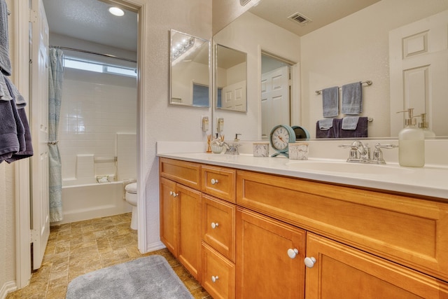 3216 Janine Ave, Rosamond, CA 93560 - bathroom featuring toilet, double vanity, and shower / tub combo