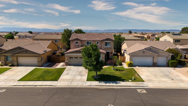 3216 Janine Ave, Rosamond, CA 93560 - traditional home with a residential view, driveway, a mountain view, a tiled roof, and a garage