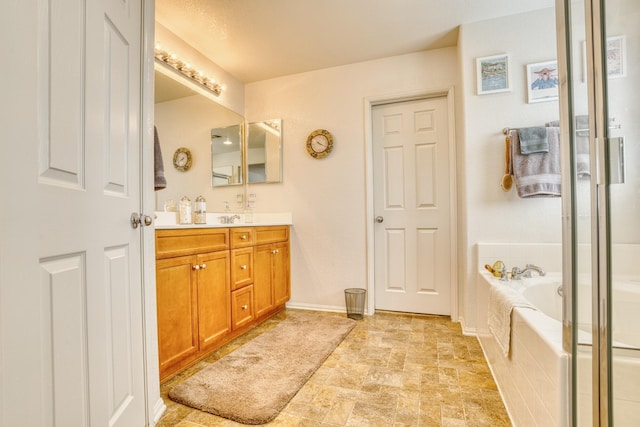 3216 Janine Ave, Rosamond, CA 93560 - bathroom with double vanity, a bath, a shower with door, and stone finish floors