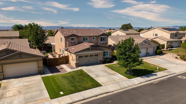 3216 Janine Ave, Rosamond, CA 93560 - view of front of home with stone siding, a residential view, driveway, and stucco siding