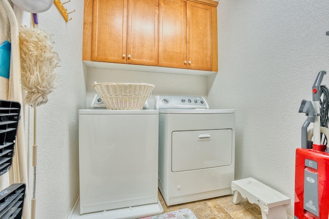 3216 Janine Ave, Rosamond, CA 93560 - laundry area with washer and clothes dryer, cabinet space, and a textured wall