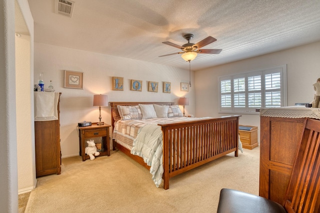 3216 Janine Ave, Rosamond, CA 93560 - bedroom featuring light carpet, a ceiling fan, and a textured ceiling