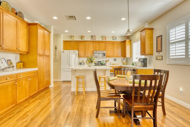 3216 Janine Ave, Rosamond, CA 93560 - dining area with light wood finished floors, baseboards, and recessed lighting
