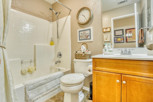 3216 Janine Ave, Rosamond, CA 93560 - full bath with shower / bath combo with shower curtain, toilet, a textured wall, and vanity