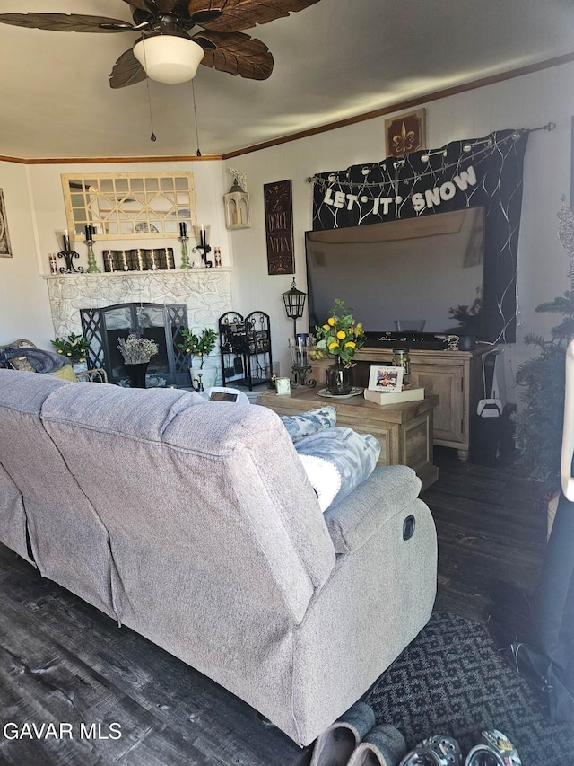 1283 W Lancaster Blvd, Lancaster, CA 93534 - living room with wood finished floors, a ceiling fan, a fireplace, and ornamental molding