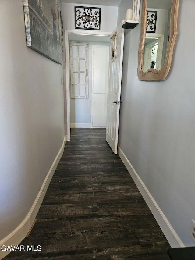 1283 W Lancaster Blvd, Lancaster, CA 93534 - corridor featuring baseboards and dark wood finished floors