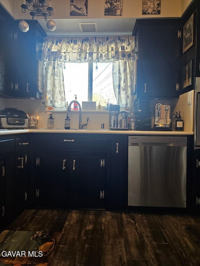 1283 W Lancaster Blvd, Lancaster, CA 93534 - kitchen featuring dishwasher, blue cabinets, light countertops, and dark wood finished floors