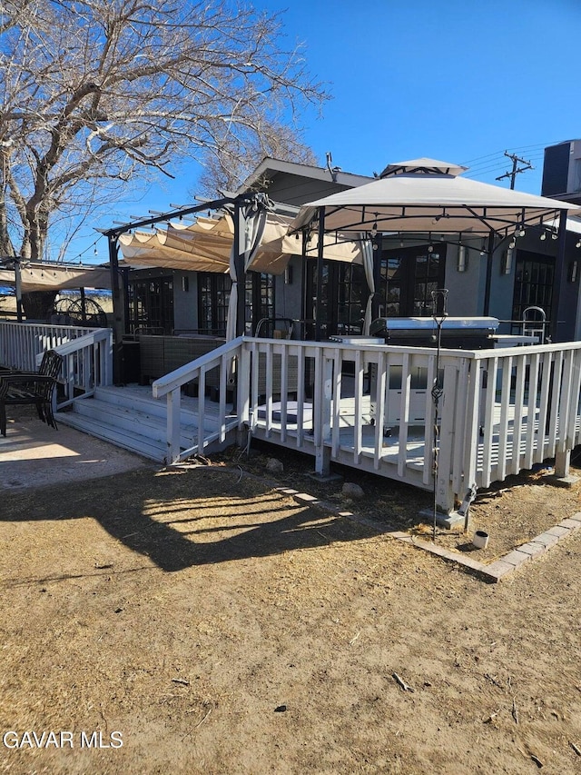 1283 W Lancaster Blvd, Lancaster, CA 93534 - rear view of house featuring a gazebo and a deck