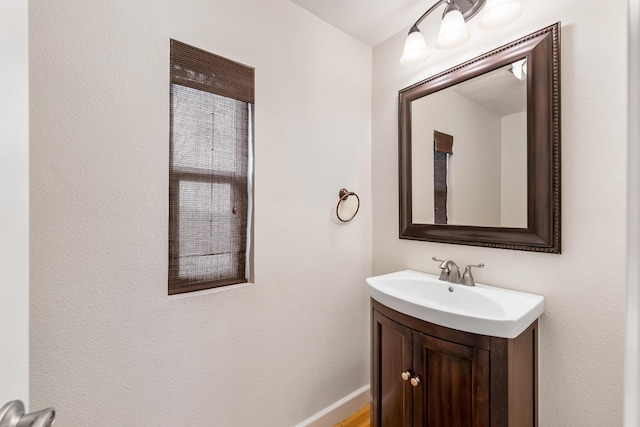 bathroom featuring vanity and baseboards