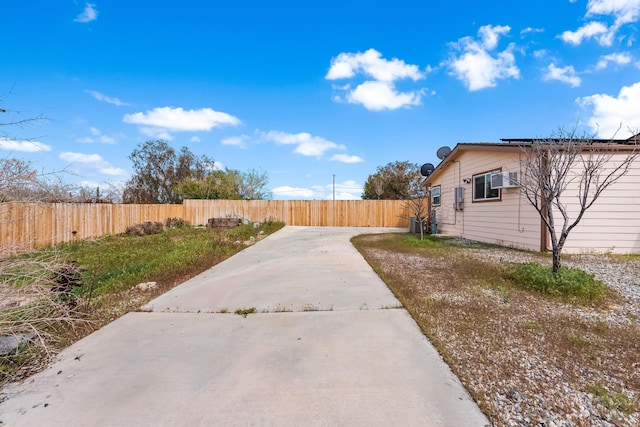 view of home's exterior featuring fence private yard and roof mounted solar panels