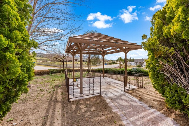 view of property's community featuring a gate