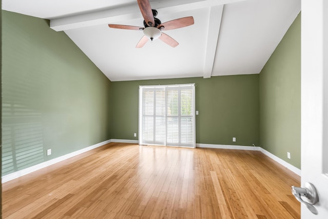 spare room with vaulted ceiling with beams, light wood-style flooring, baseboards, and ceiling fan