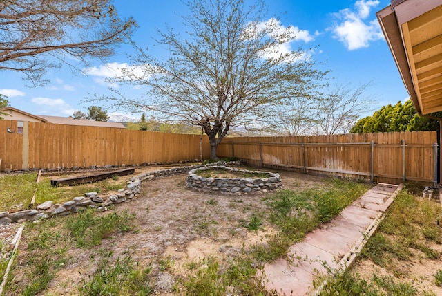 view of yard with a fenced backyard