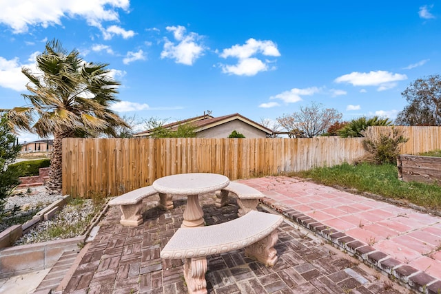 view of patio featuring fence