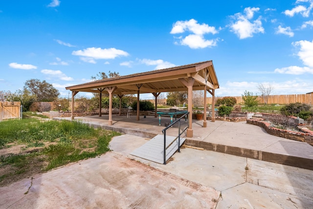 view of patio with fence and a gazebo