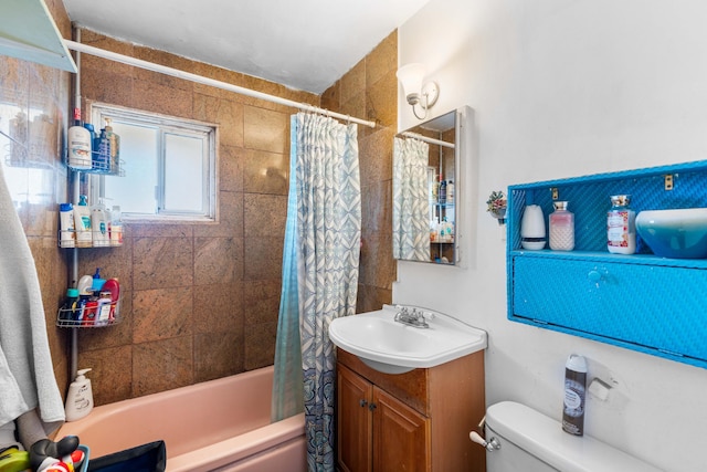 full bathroom with shower / bath combination with curtain, vanity, and toilet