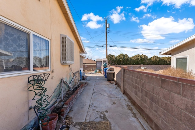 view of property exterior with a patio area