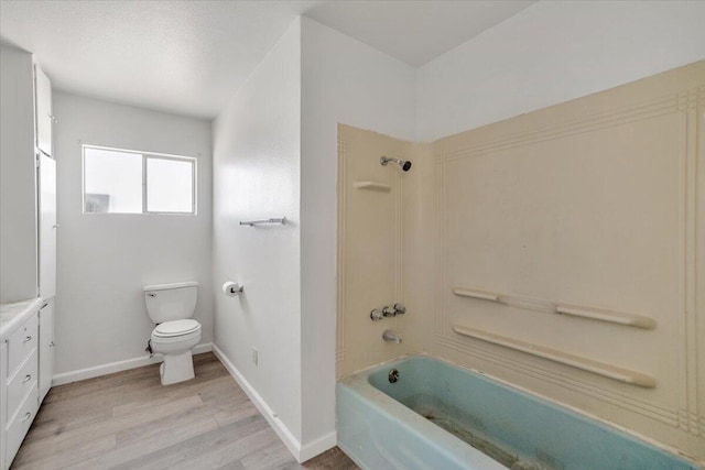 39441 E 140th St, Palmdale, CA 93591 - full bathroom with wood finished floors, toilet, bathtub / shower combination, vanity, and baseboards