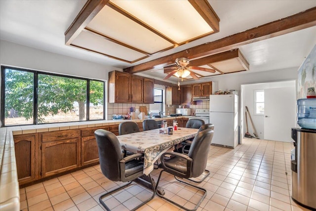39441 E 140th St, Palmdale, CA 93591 - kitchen with white appliances, tile counters, decorative backsplash, and plenty of natural light