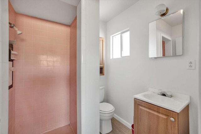 39441 E 140th St, Palmdale, CA 93591 - bathroom featuring toilet, tiled shower, and vanity