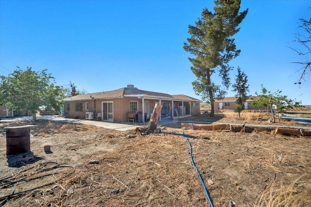 39441 E 140th St, Palmdale, CA 93591 - back of house featuring a patio area and a chimney