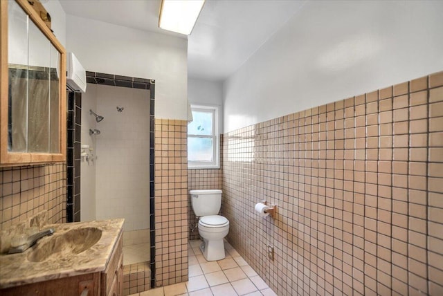 39441 E 140th St, Palmdale, CA 93591 - bathroom with tile walls, toilet, tile patterned floors, a walk in shower, and wainscoting