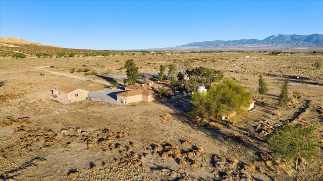 39441 E 140th St, Palmdale, CA 93591 - aerial overview of property's location with a mountain backdrop, rural landscape, and a desert landscape