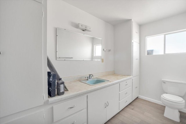 39441 E 140th St, Palmdale, CA 93591 - bathroom with wood finished floors, toilet, and vanity