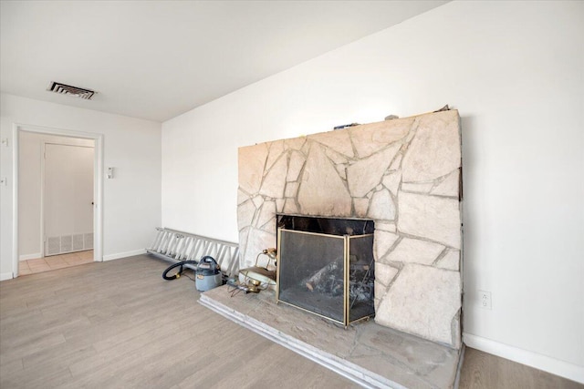 39441 E 140th St, Palmdale, CA 93591 - detailed view of wood finished floors, baseboards, and a fireplace