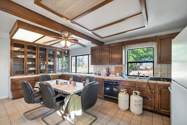 39441 E 140th St, Palmdale, CA 93591 - kitchen with dishwasher, backsplash, healthy amount of natural light, and a ceiling fan