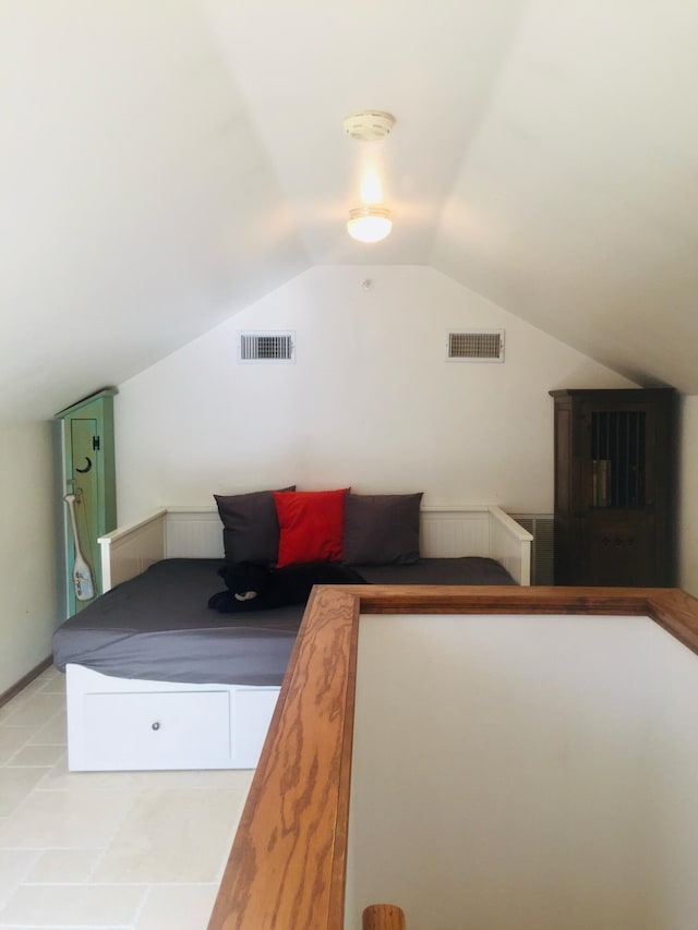 bedroom with lofted ceiling