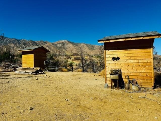 view of outdoor structure featuring a mountain view