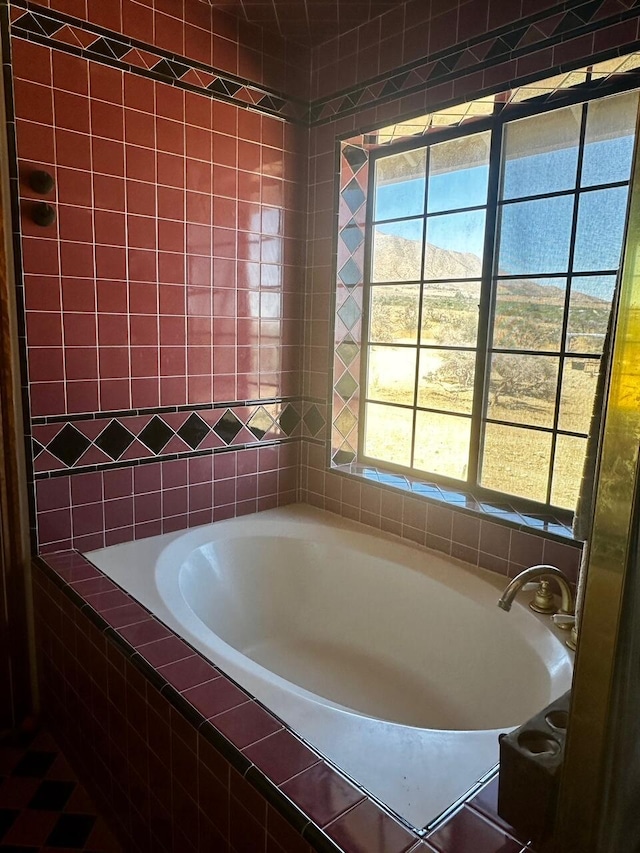 bathroom featuring tiled bath