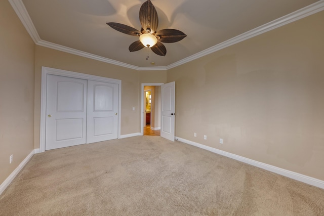 24281 Jacaranda Dr, Tehachapi, CA 93561 - unfurnished bedroom with crown molding, a closet, carpet, and baseboards