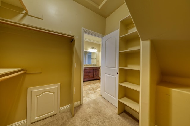 24281 Jacaranda Dr, Tehachapi, CA 93561 - walk in closet featuring light carpet