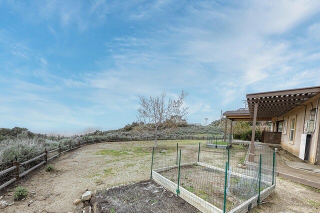 24281 Jacaranda Dr, Tehachapi, CA 93561 - view of yard with fence and a garden