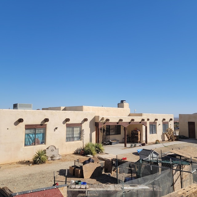 back of house featuring a patio area