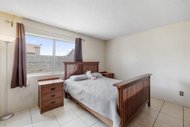 tiled bedroom with a textured ceiling