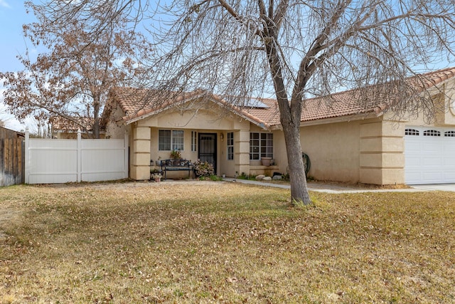 single story home with a garage and a front yard