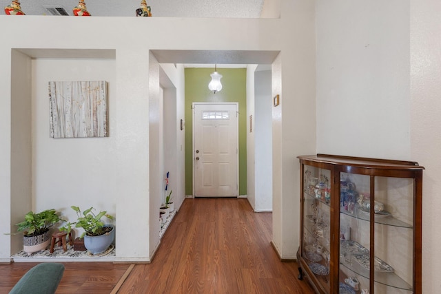 entryway with hardwood / wood-style flooring