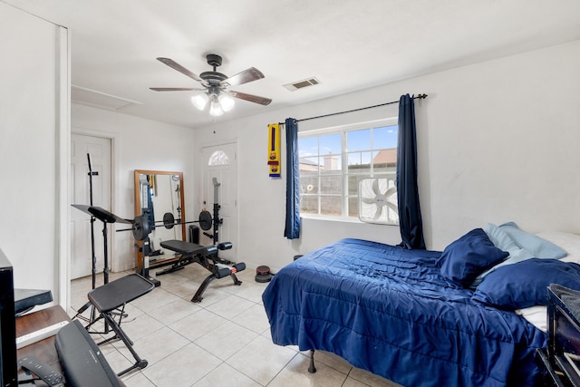 bedroom featuring light tile patterned floors and ceiling fan