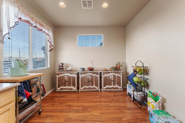 interior space with light brown cabinets and light wood-type flooring